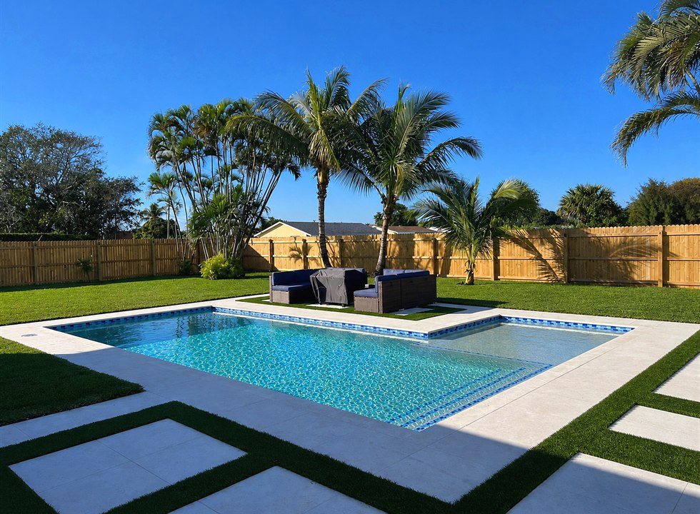 Backyard pool with turf grid patio