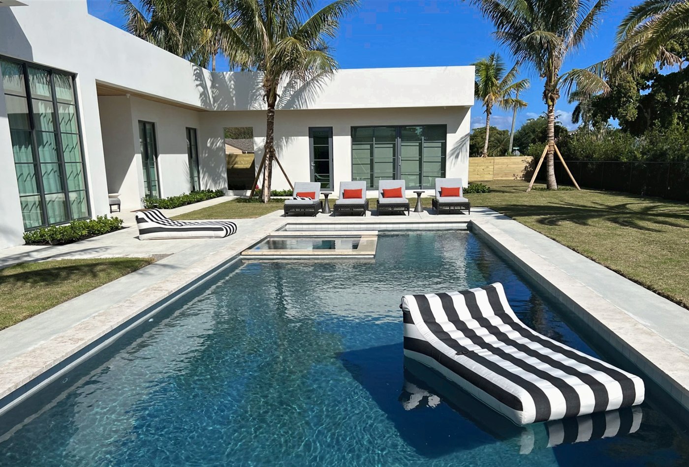 Luxury custom pool with spa and modern patio